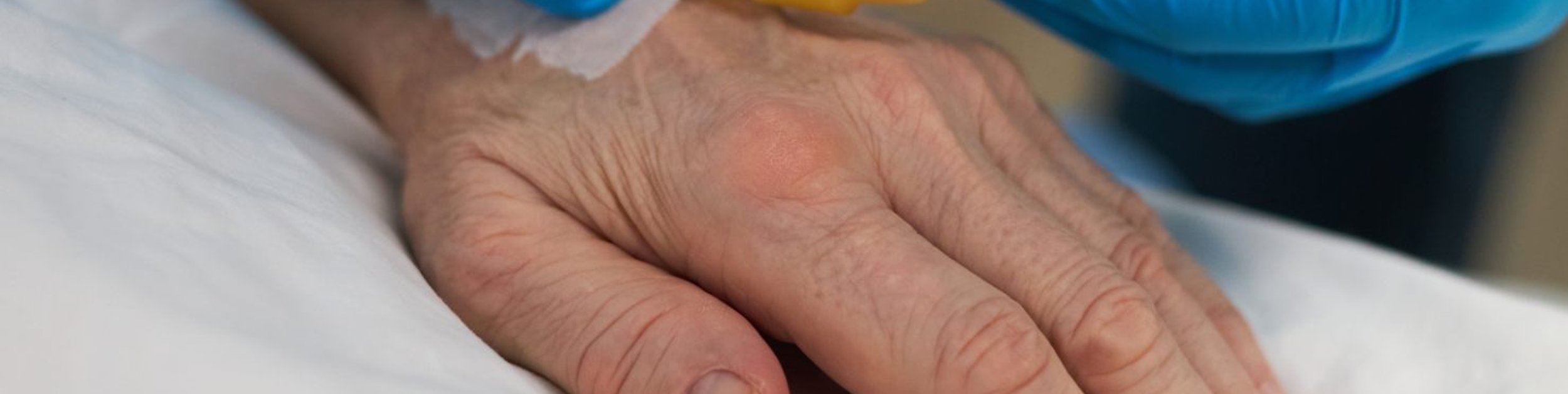 hands of caregiver and patient